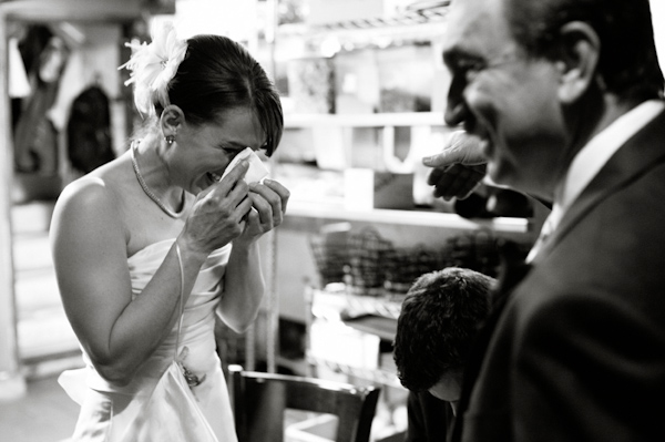 the happy bride wiping away her tears of happiness - photo by Denver based wedding photographers Adam and Imthiaz